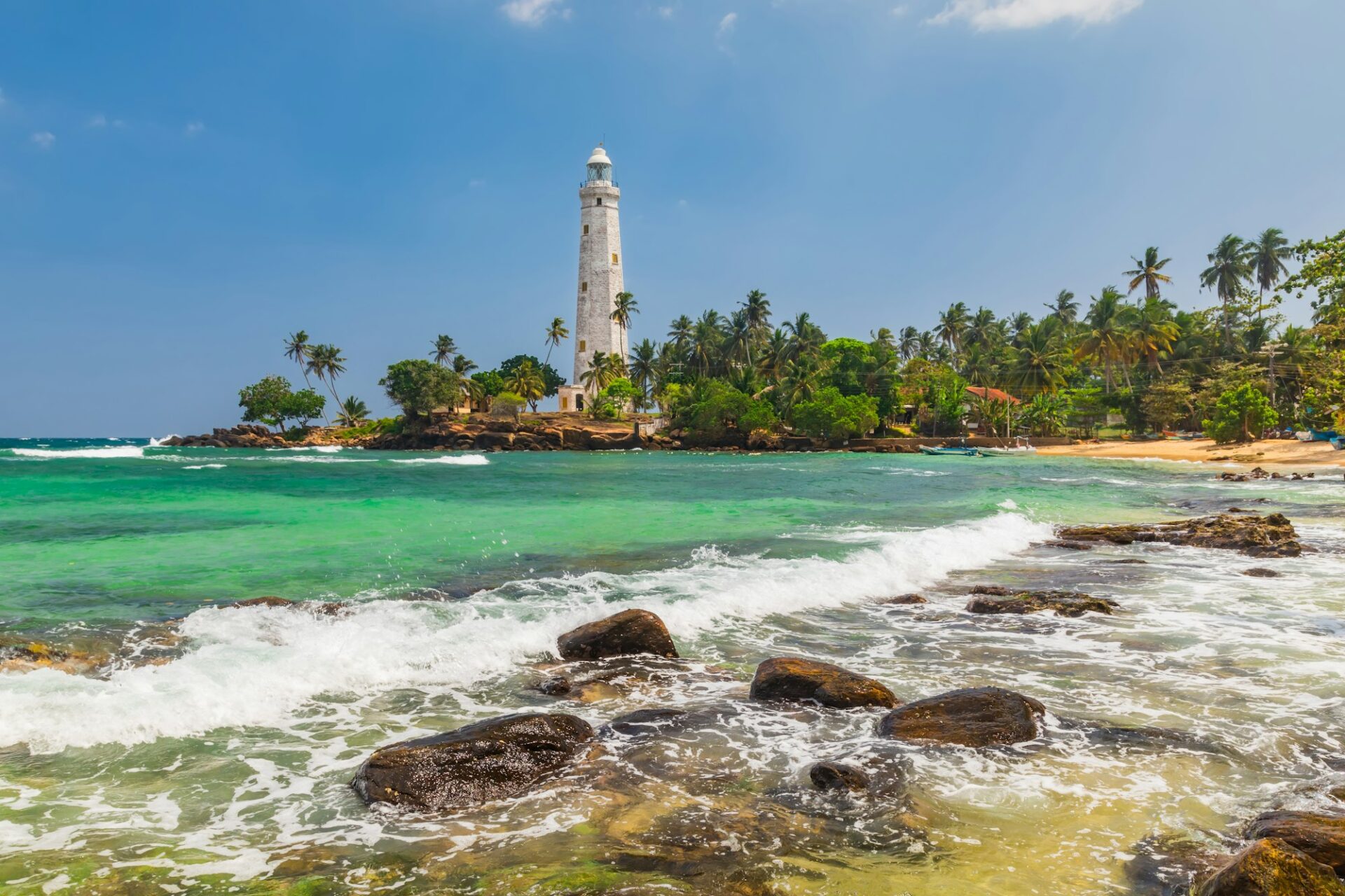 White lighthouse Dondra Head and tropical palms, Sri Lanka, near Matara.