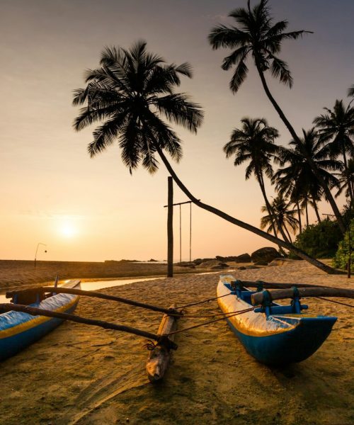 Fishing boat on the beach at sunset. Sri Lanka